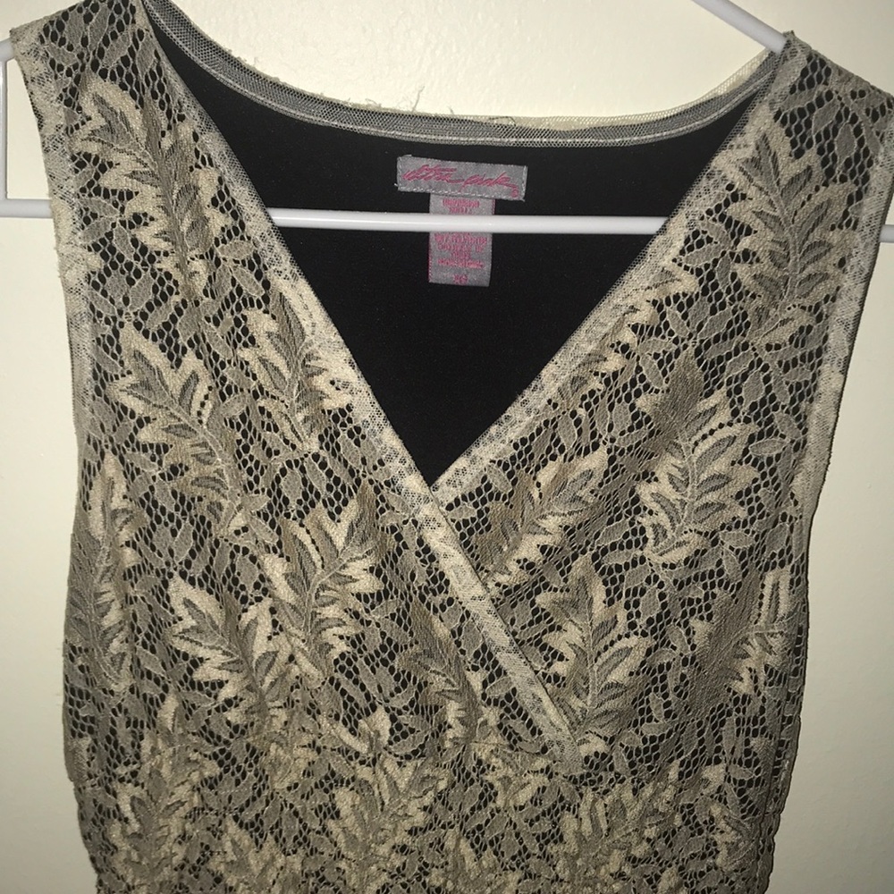 Tan dress with black underlay.